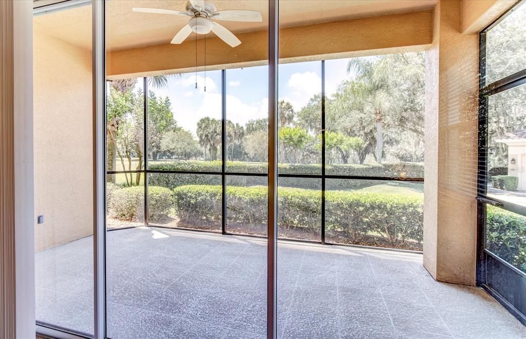 Covered 10' X 18' screened in patio.  Triple doors hide behind the wall.