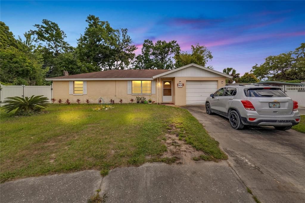 Front of home with long extended driveway that can fit 2 vehicles.