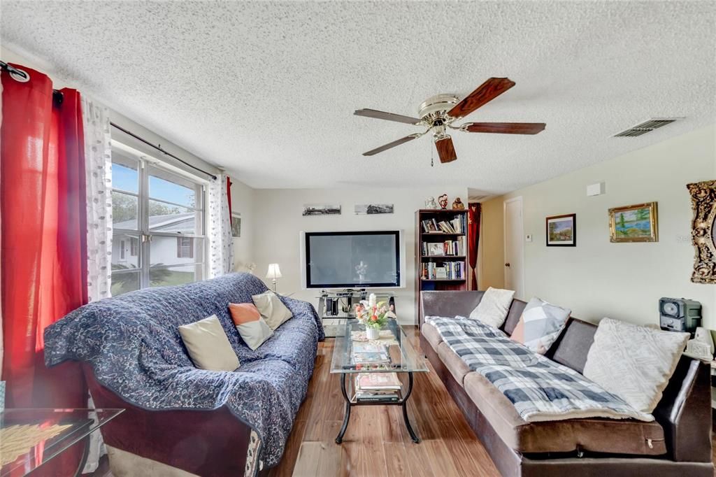 Living room view with hardwood floors.