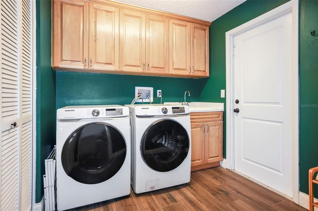 Gas dryer, elect washer, utility sink and closet storage