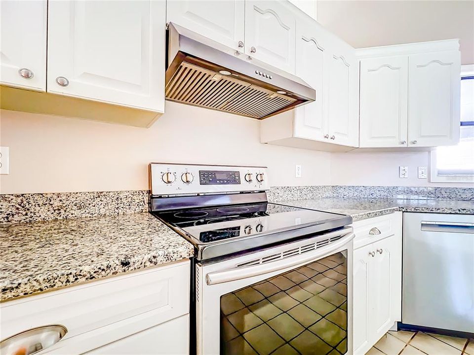 Spacious laundry room with plenty of storage and washer and dryer