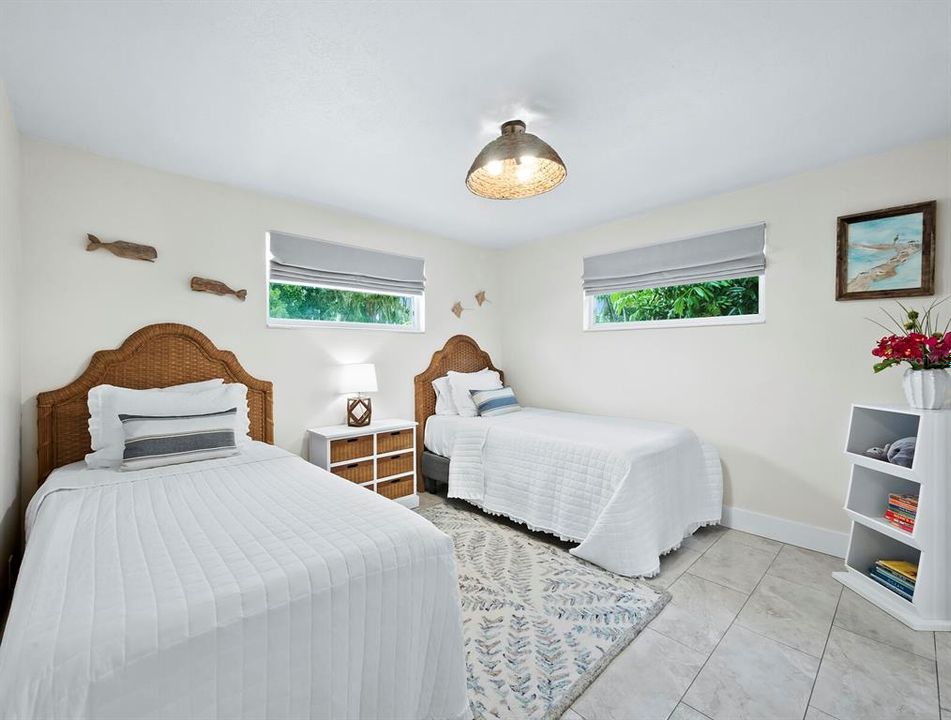 The second bedroom is spacious enough for two twin beds or could easily fit a queen sized bed.