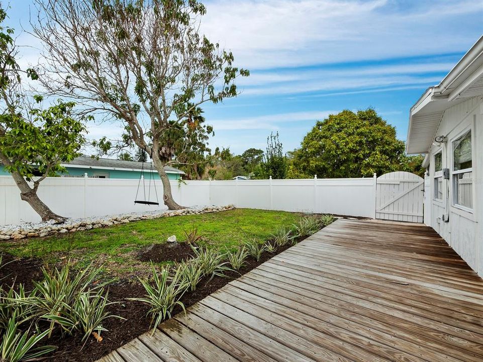 Along the deck you'll find a landscaped side yard and gate to access the front of the home.
