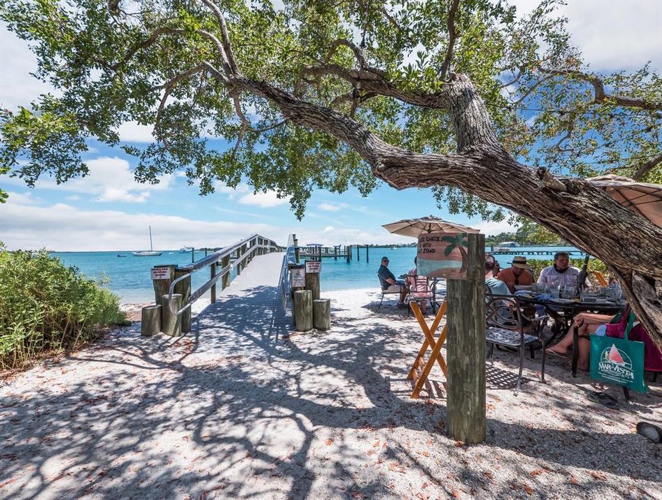 Dine under the buttonwood trees on the bays.