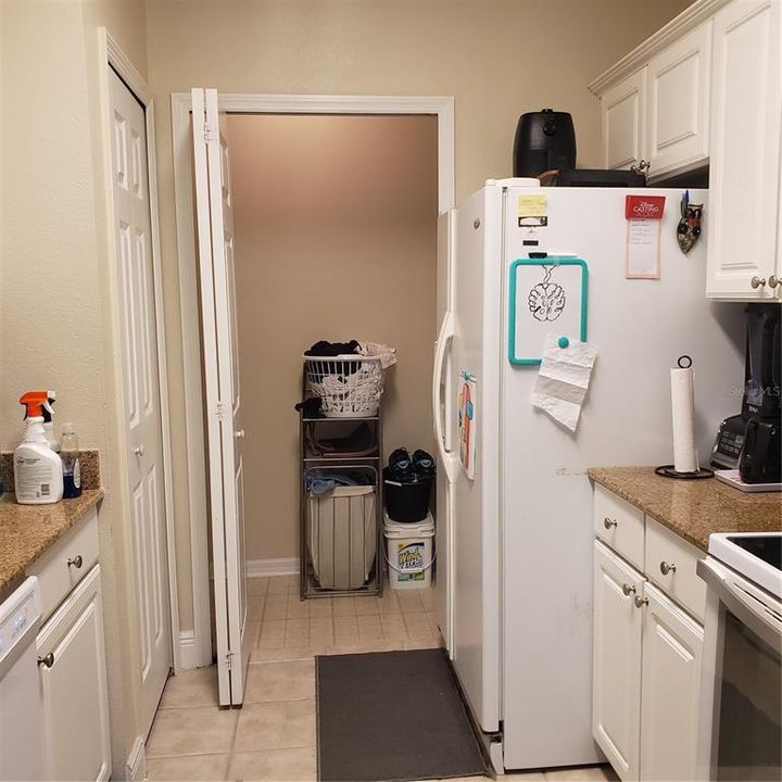 Standing in Kitchen looking toward Utility Room with Washer and Dryer