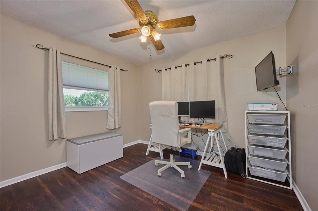 The front bedroom is currently being used as a home office.