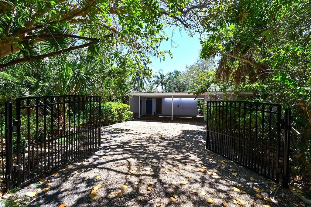 Gated front entrance to this Mid-Century Modern older house.