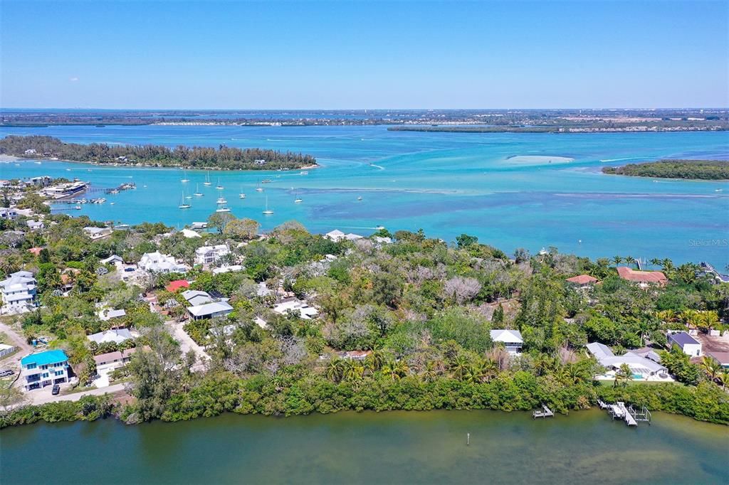 Bishops Bayou towards Jewfish Key, The Shore Restaurant and Mar Vista with Cortez and Bradenton in the background.