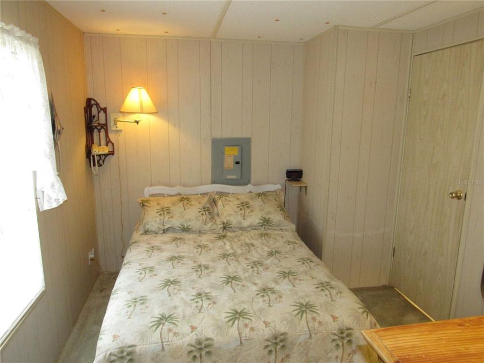 Guest bedroom with walk-in closet.