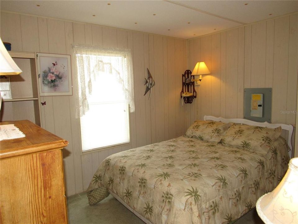 Guest bedroom with walk-in closet.