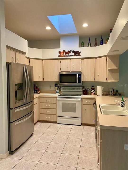 Roomy kitchen space with a skylight for natural light