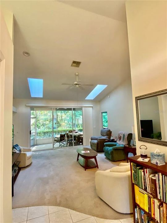 View entering home showing two skylights and patio area