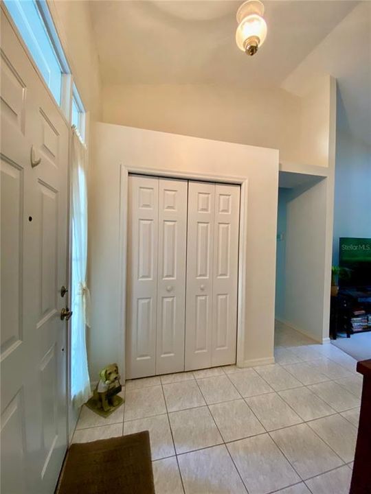 Entrance with closet for coats/storage