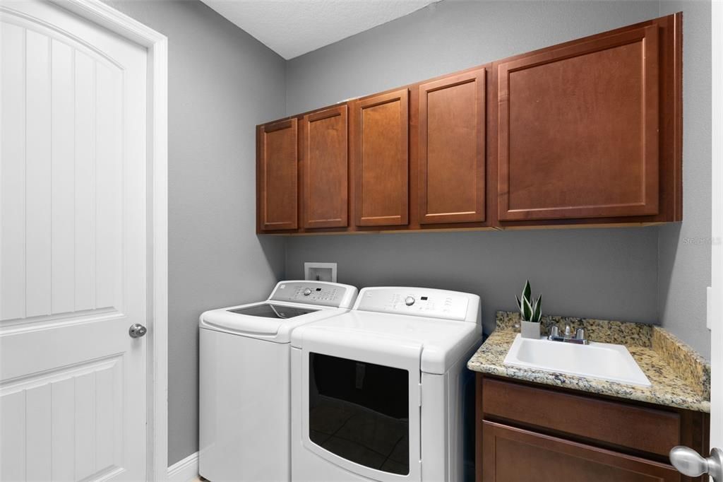 Laundry Room with Sink, Washer and Dryer