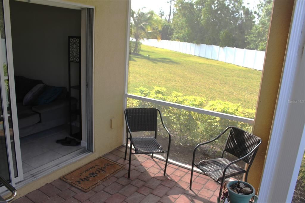 Screened-in porch with sliding door access from living room