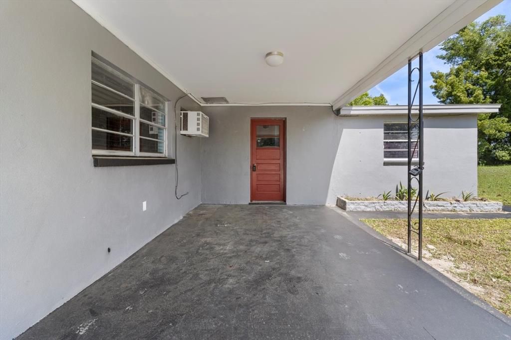 Entry under Carport leads into the Laundry Room