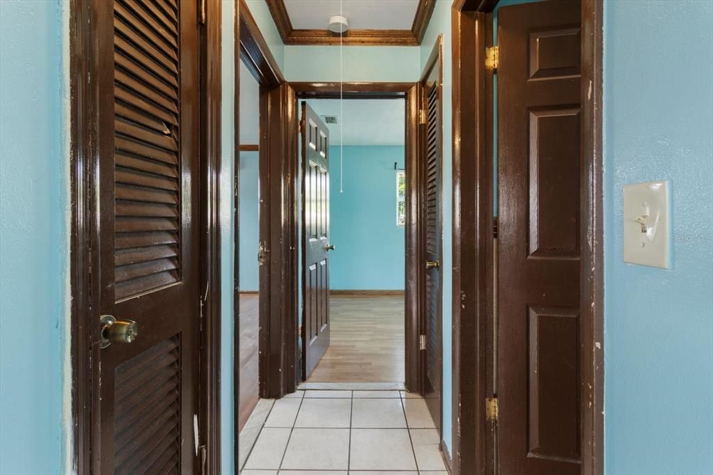 Hallway to Bedrooms..Coat Closet on Left and Linen Closet on Far Right