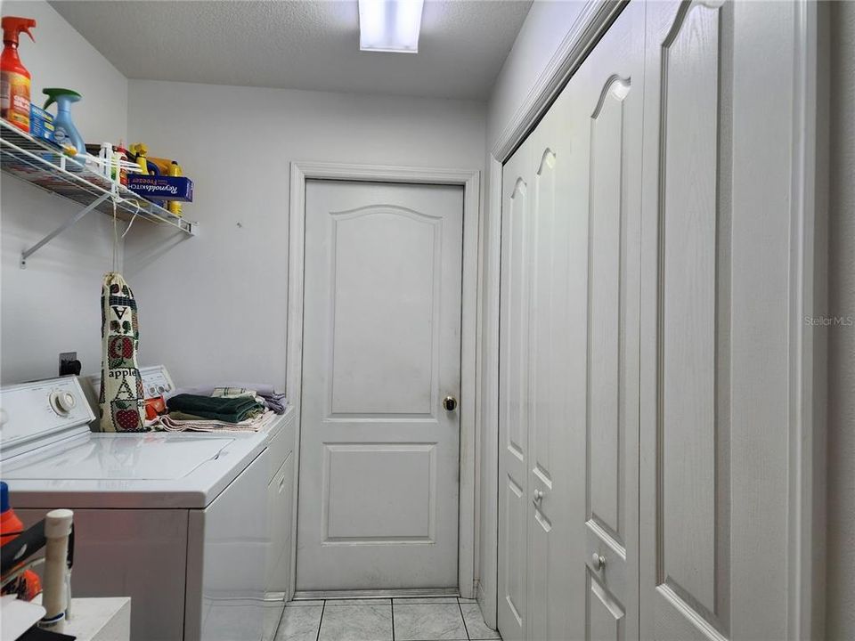 Laundry Room with large pantry and showing the door leading into the garage.