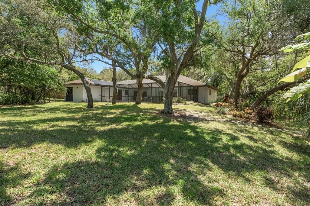 Oversized lot with Mature Landscaping backed up to seasonal lake