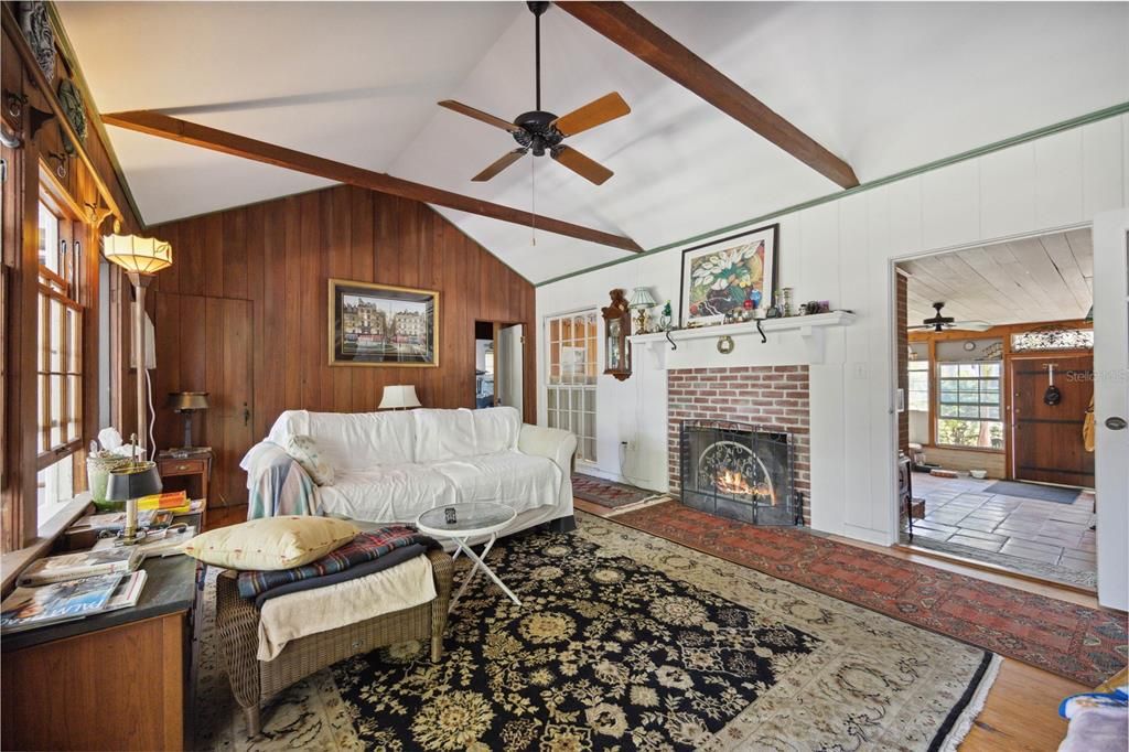 Enjoy the spacious family room which offers a fireplace, cathedral ceilings with ceiling fans, along with a brick fireplace. This room also has a closet with windows facing north which gives off the perfect amount of natural lighting.
