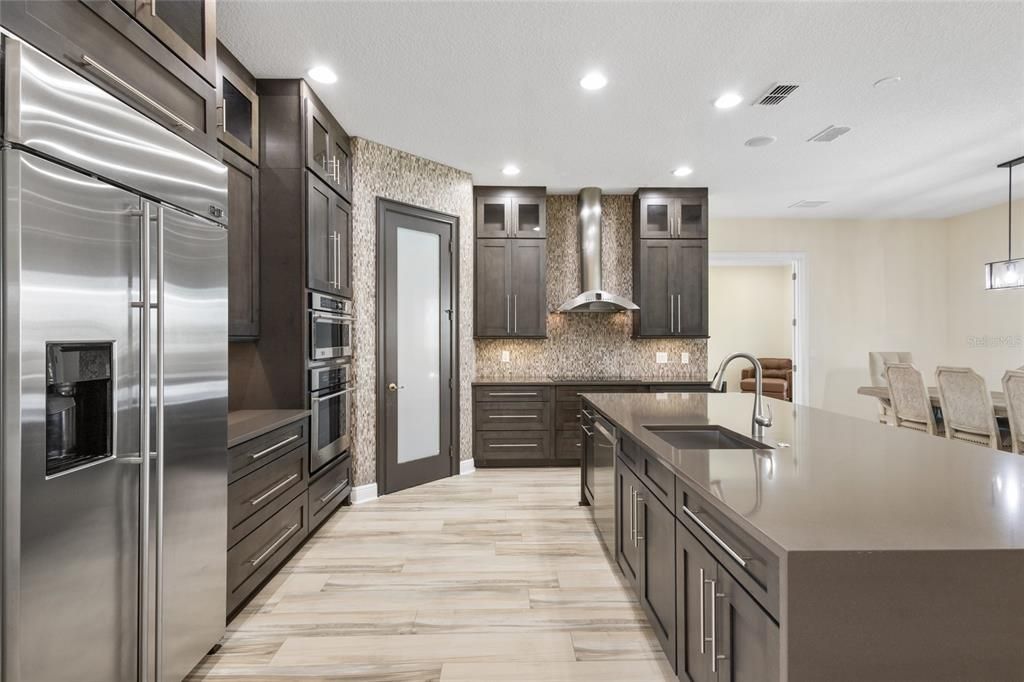 Stunning kitchen with large cooking island, range hood and sizeable walk in pantry. All kitchen appliances are included.