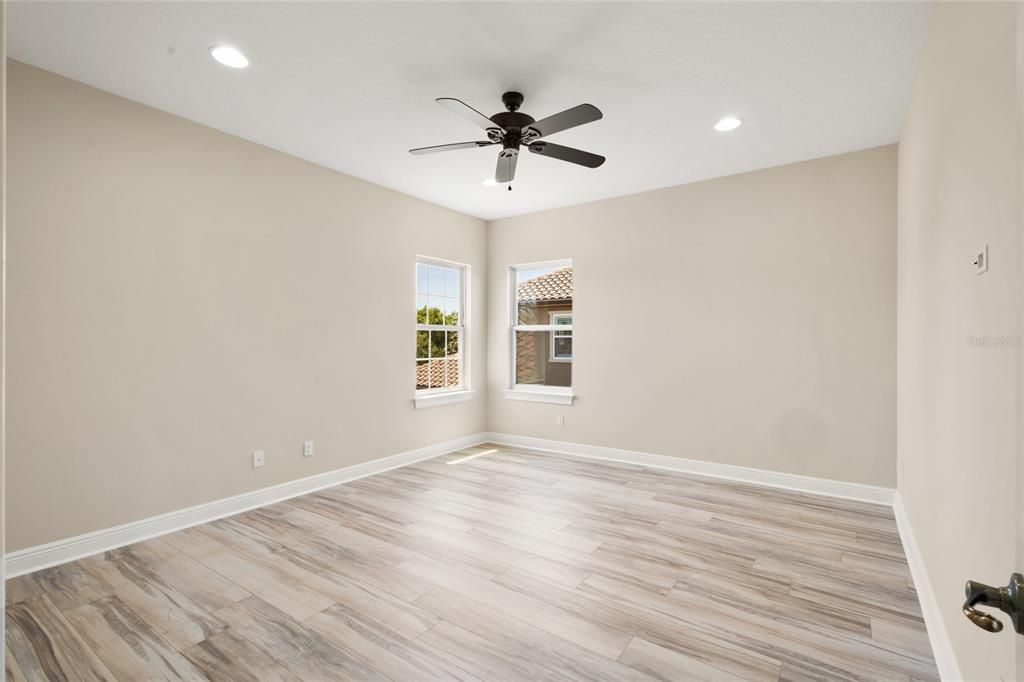 Bedroom 3 with ceiling fan and new flooring!