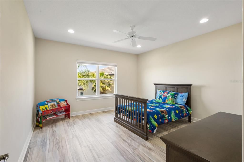 Bedroom 6 with great walk in closet, ceiling fan and new laminate flooring!