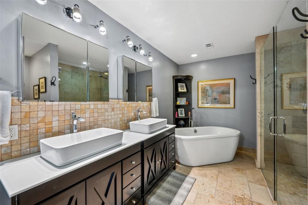 Master Bath with s large walk-in shower and dual sinks and tub
