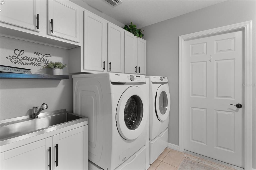 Laundry Room, new washer & dryer, cabinets & utility sink