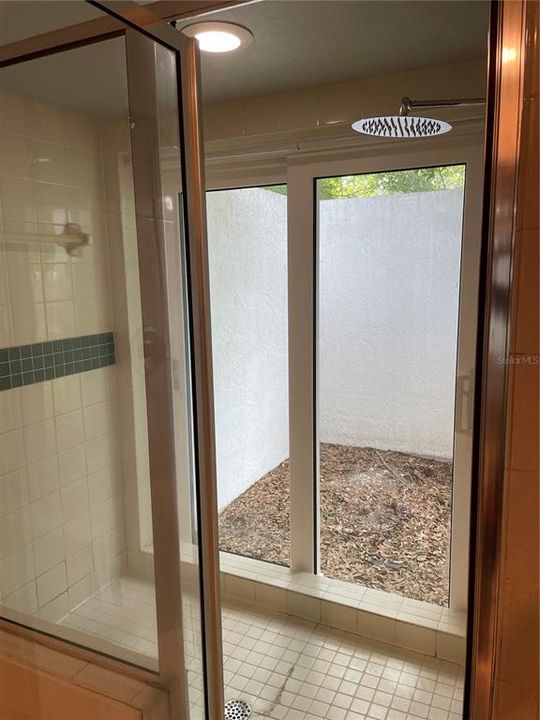 Primary Bathroom Walk-in Shower with Private Outdoor Garden View
