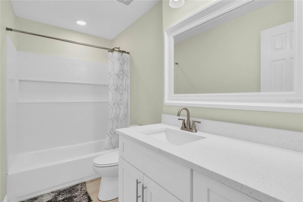 The 2nd bathroom includes shower/tub combination and quartz countertops.
