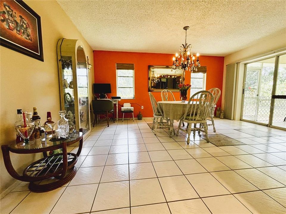 Interior view. Dining area would be approximately where the liquor table is sitting adjacent to the kitchen