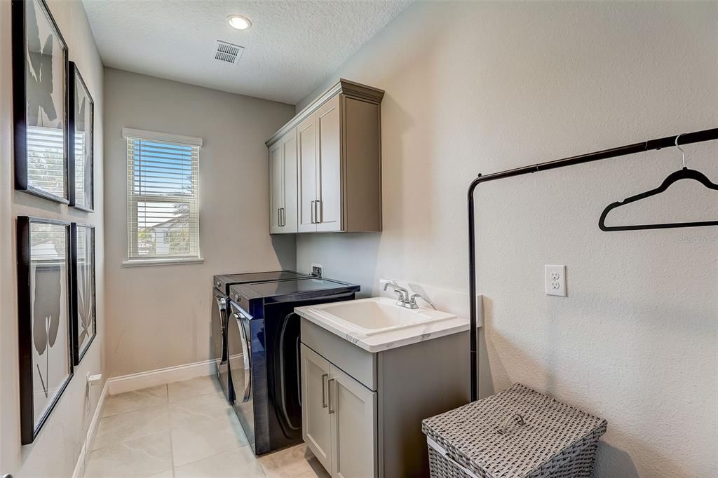LAUNDRY ROOM WITH UTILITY SINK AND CABINET SPACE