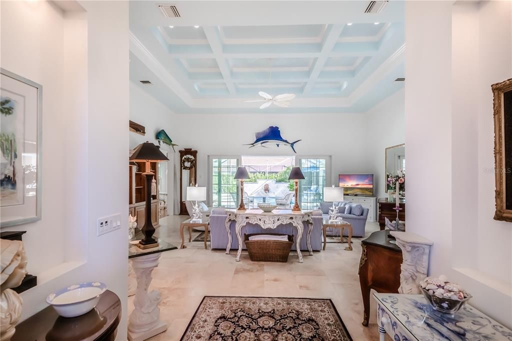 Great room with tray and coffered 15' ceilings