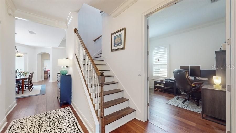 CUSTOM STAIRWELL WITH VIEWS OF BEDROOM TWO / OFFICE