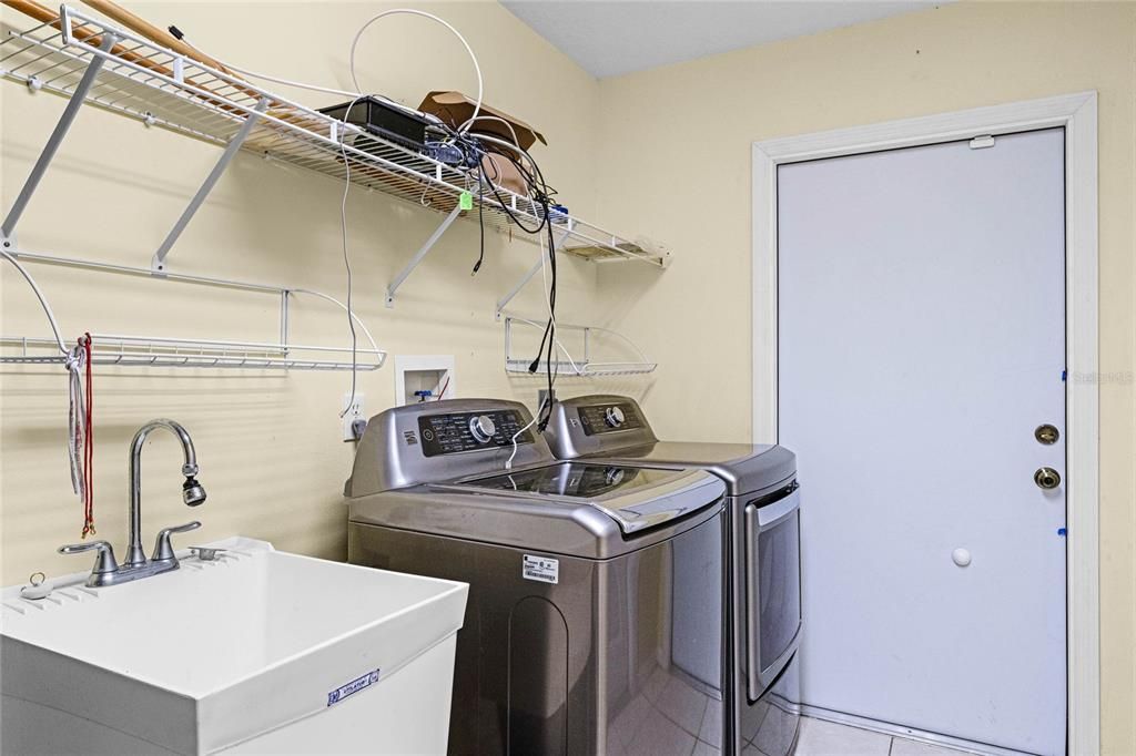 Laundry room with Kenmore Elite appliances & wash basin