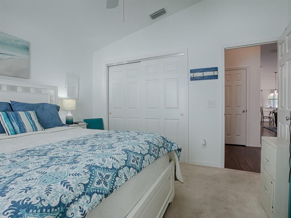 DOUBLE-DOOR CLOSET AND HIGH, VAULTED CEILING