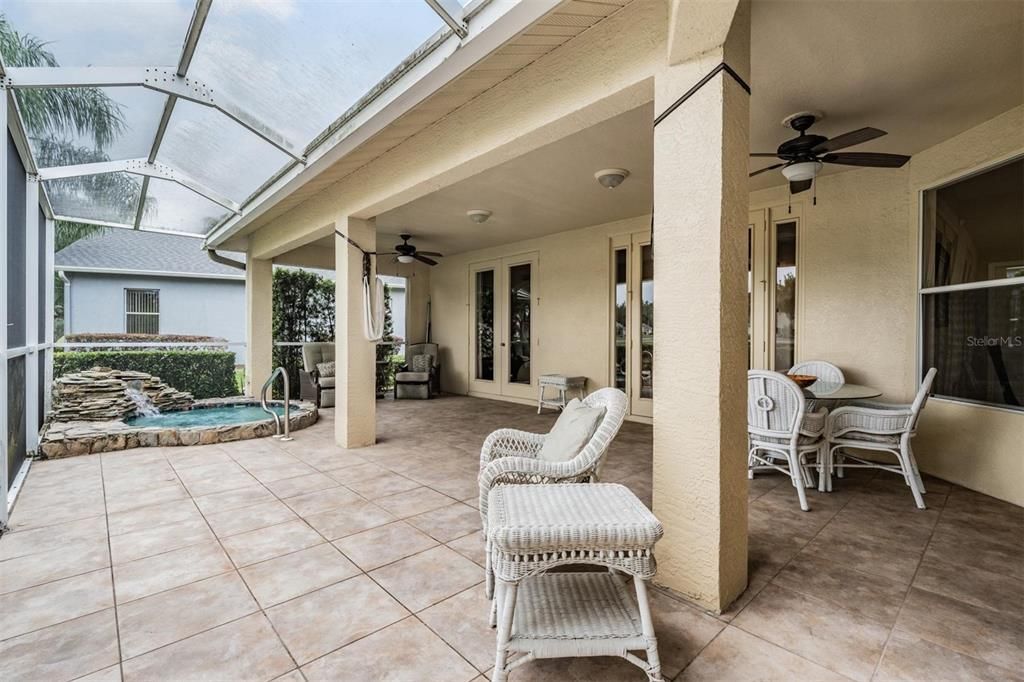 Such a thoughtful lanai layout with easy-care flooring and covered areas for the hot days