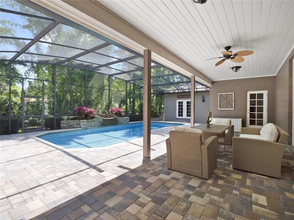 Step outside to the expansive screened lanai and revel in the breathtaking pool views.