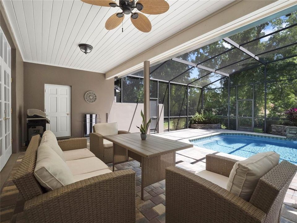 Step outside to the expansive screened lanai and revel in the breathtaking pool views.