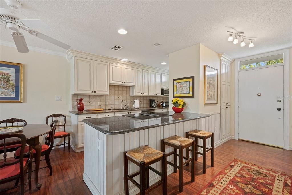 Gourmet kitchen with granite, SS appliances, newer cabinets and breakfast bar