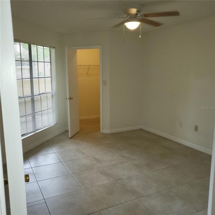 master bedroom with walk in closet