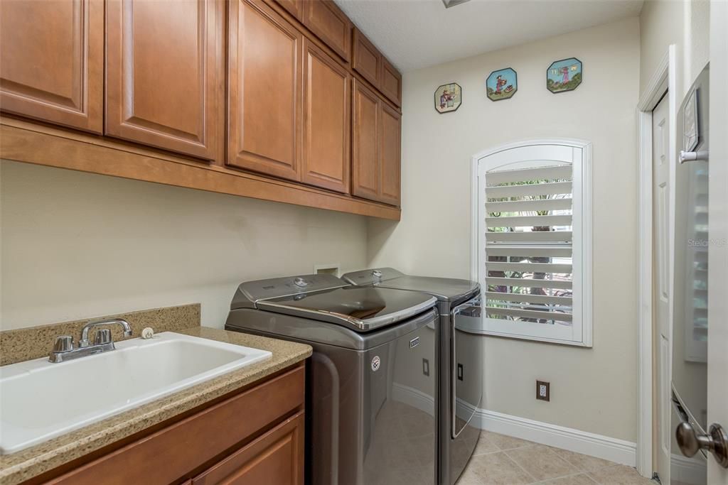laundry room is downstairs and also has a refrigerator and a sink!