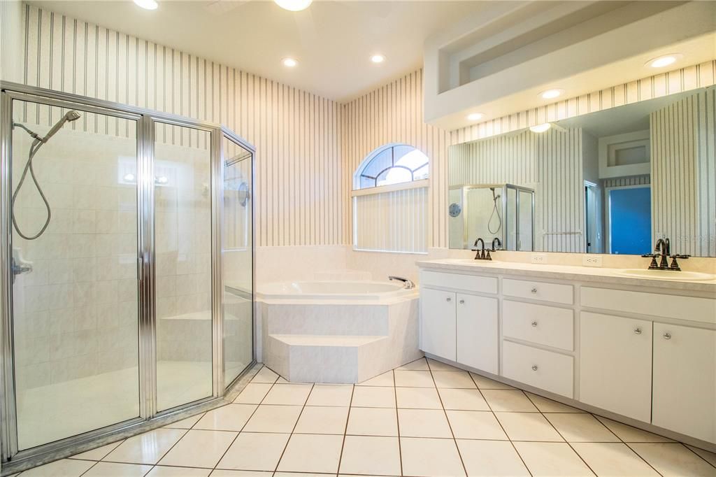 Oversized shower with bench, Garden Tub and double vanities