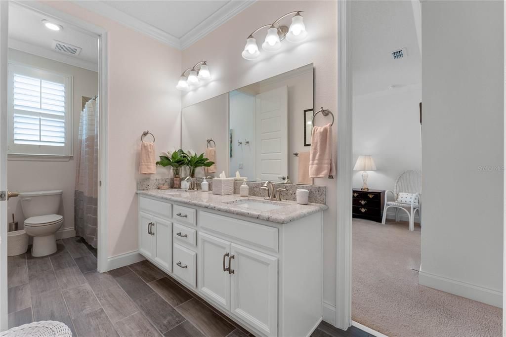 Jack n Jill bath between bedroom 3 and 4 with dual sink vanity, crown molding and huge linen closet