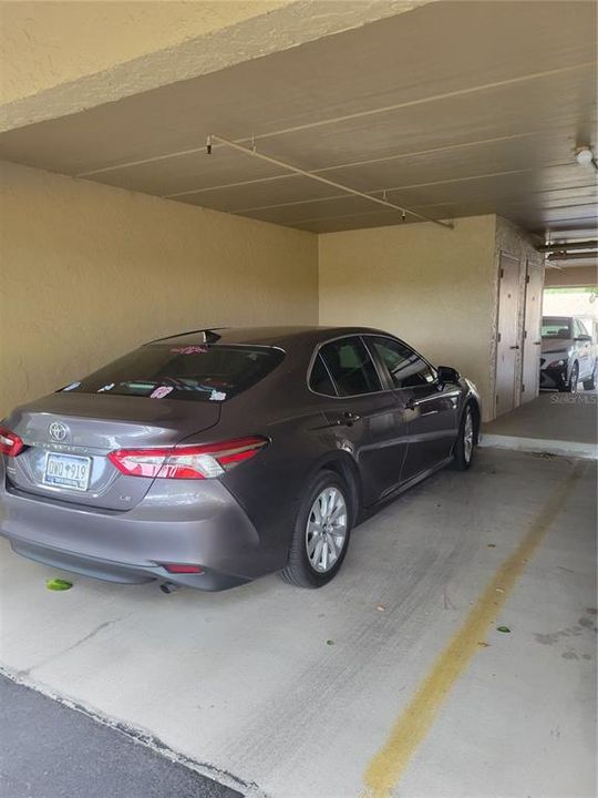 Under building Covered Carport, reserved space