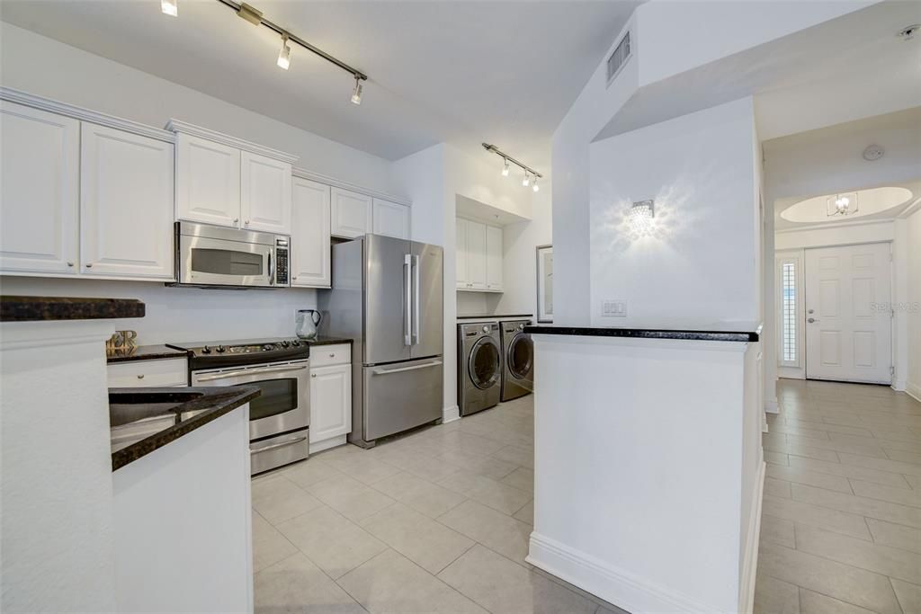 Full Size Kitchen with Stone Countertops, Stainless Steel Appliances and Full-Size Washer and Dryer