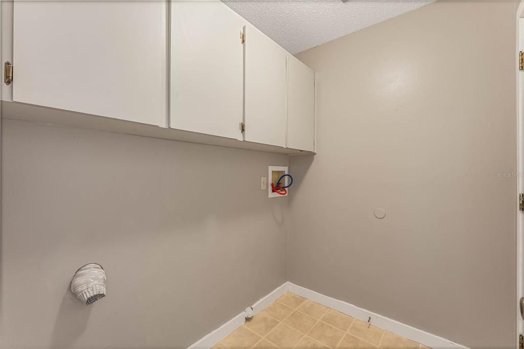 Interior laundry room with access to the 2-car garage!