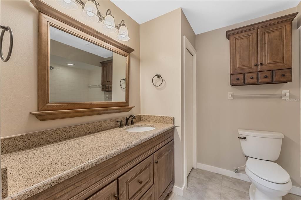 Secondary bathroom with elongated vanity and linen closet!
