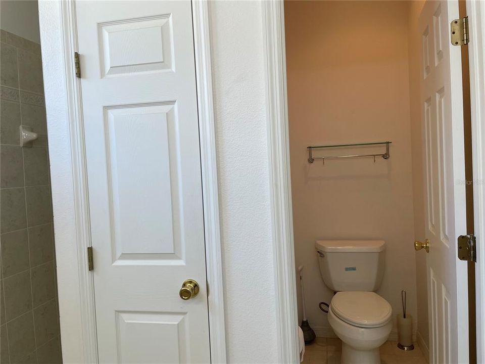 Primary bath with private water closet and linen closet